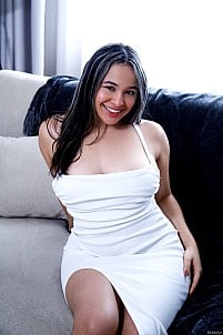 The busty curvy Valery pulls off her white dress to reveal her trimmed pussy